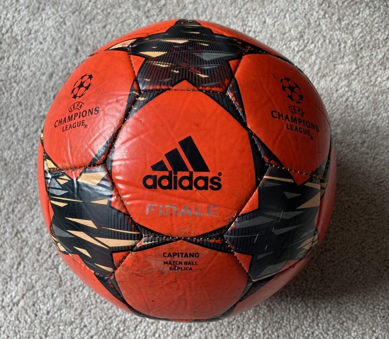 adidas UCL Pro Void Winter Ball – Solar Orange/Silver Metallic/Black/Bright Cyan